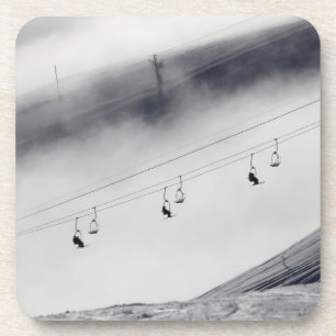 Skiers on a chair lift coaster