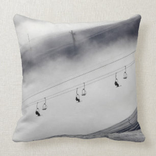 Skiers on a chair lift throw pillow