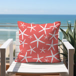 Skinny Starfish | Coral and White Throw Pillow<br><div class="desc">Skinny white starfish from large to small dance around this throw pillow! Perfect for any summer beach house or for any room with a beach or ocean theme. Coral coloured background with White Starfish is set for this decorative pillow template. If you would like a different coloured background please email...</div>