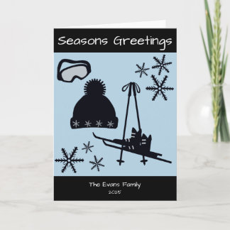 Skis, hat, goggles & snowflakes holiday card