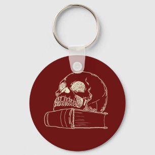 Skull and a book keychain