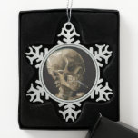 Skull with Burning Cigarette Vincent van Gogh Art Snowflake Pewter Christmas Ornament<br><div class="desc">Vincent van Gogh (Dutch, 1853 - 1890) Skull of a Skeleton with Burning Cigarette, 1885–86, Oil on canvas Unframed: 32 cm × 24.5 cm (13 in × 9.6 in) Early work by Vincent van Gogh. This small painting is part of the permanent collection of the Van Gogh Museum in Amsterdam....</div>