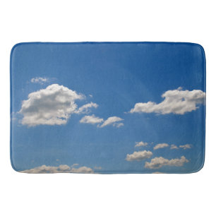 Sky is blue and white clouds are passing by   bath mat