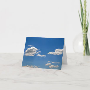 Sky is blue and white clouds are passing by   card