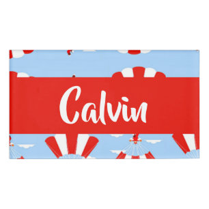 Skydiver with red and white parachute pattern name tag