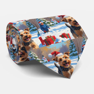 Skye Terrier Running in Snow with Christmas Hat Tie