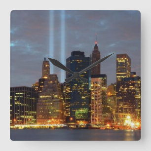 Skyline view of city in night. square wall clock