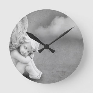 Sleeping angel on grey background, angelic art round clock