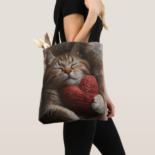 SLEEPING ORANGE TABBY CAT WITH HEART SHAPED PILLOW TOTE BAG