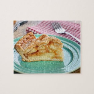 Slice of fresh baked apple pie on plate jigsaw puzzle