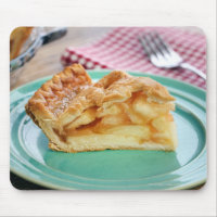 Slice of fresh baked apple pie on plate