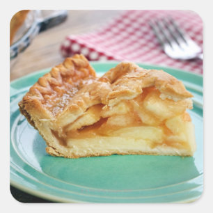 Slice of fresh baked apple pie on plate square sticker