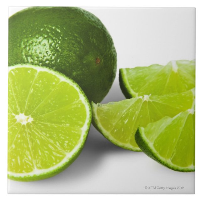 Sliced lime wedge, on white background, cut out tile (Front)