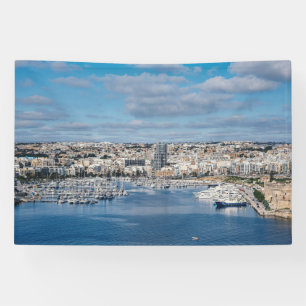 Sliema harbour with modern buildings and boats banner