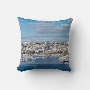 Sliema harbour with modern buildings and boats throw pillow