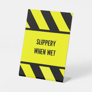 slippery when wet pedestal sign