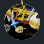SlipperyJoe Hanukkah symbolic still life holiday e Ceramic Ornament<br><div class="desc">SlipperyJoe Hanukkah symbolic still life holiday essence vibrant meaningful objects colourful slender pile menorah candles artistic red blue yellow and white sufganiyah doughnut classic jelly-filled commemorate miracle of the oil dreidels metallic gold glossy blue Hebrew great miracle happened there metallic pewter star of David medallion light resilience community themes spiritual...</div>