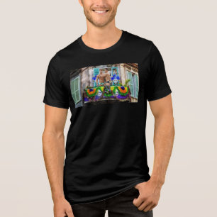 SlipperyJoe's festive Mardi Gras scene two men wea Tri-Blend Shirt