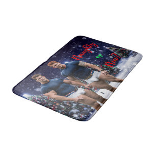 SlipperyJoe's glowing Christmas trees two muscular Bath Mat