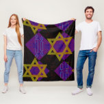 SlipperyJoe's Hanukkah-themed image golden yellow  Fleece Blanket<br><div class="desc">SlipperyJoe's Hanukkah-themed image golden yellow Star of David blue candles with orange flames Menorah-inspired art gift idea Jewish identity spirituality holiday retro bold symmetrical pattern diamond-shaped grid background blends tradition and vibrant design purple black chequerboard effect Hebrew religious celebration</div>