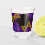 SlipperyJoe's Hanukkah-themed image golden yellow  Shot Glass<br><div class="desc">SlipperyJoe's Hanukkah-themed image golden yellow Star of David blue candles with orange flames Menorah-inspired art gift idea Jewish identity spirituality holiday retro bold symmetrical pattern diamond-shaped grid background blends tradition and vibrant design purple black chequerboard effect Hebrew religious celebration</div>