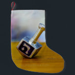 SlipperyJoe's Happy Hanukkah four-sided spinning t Small Christmas Stocking<br><div class="desc">SlipperyJoe's Happy Hanukkah four-sided spinning top dreidel artistic Celebration Candles Jewish Hebrew Chanukah gifts decorations Judaism religion Hebrew letter Nun traditional toy children adult game cultural symbol metallic shiny finish wooden surface</div>