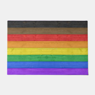 SlipperyJoe's Inclusive gay pride flag textured ru Doormat