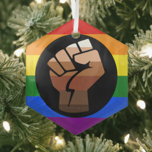 SlipperyJoe's queer people colour flag raised fist Glass Ornament