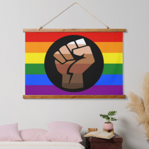 SlipperyJoe's queer people colour flag raised fist Hanging Tapestry
