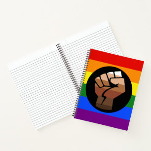 SlipperyJoe's queer people colour flag raised fist Notebook