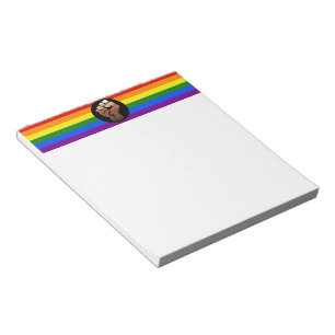 SlipperyJoe's queer people colour flag raised fist Notepad