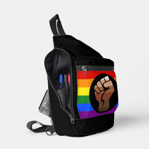 SlipperyJoe's queer people colour flag raised fist Sling Bag