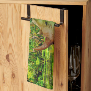 SlipperyJoe's rhinoceros lush tropical setting pri Kitchen Towel