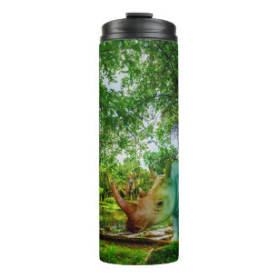 SlipperyJoe's rhinoceros lush tropical setting pri Thermal Tumbler
