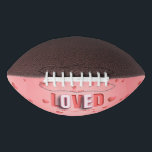 SlipperyJoe's Valentine's Day gifts romantic tone  Football<br><div class="desc">SlipperyJoe's Valentine's Day gifts romantic tone scattered heart shapes expressing love appreciation uplifting inclusive and affectionate tone vibrant celebratory graphic warmth affection soft pink canvas background you are loved text LGBTQIA white letters red outlines shadow artistic three-dimensional standout effect playful 3D-elements bold typography</div>