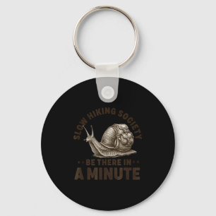 Slow hiking society be there in a minute snail keychain