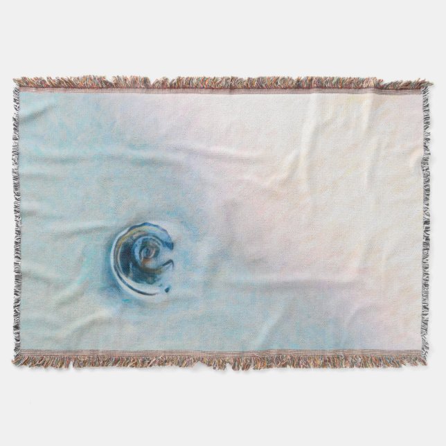 Slow motion wave toward a blue seashell throw blanket (Front)