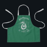 SLYTHERIN™ Pride Ambition Cunning Crest Apron<br><div class="desc">Show your house pride with this bold Slytherin™ crest design, honoring the ambition and cunning that define this iconic Hogwarts™ house. Featuring the striking serpent coiled within a classic shield, the artwork highlights Slytherin’s core traits — Ambition, Pride, and Cunning — in a clean, vintage-inspired layout. Rendered in signature house...</div>