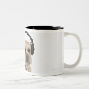 Small dog wearing headphones Two-Tone coffee mug