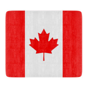 Small glass cutting board with flag of Canada