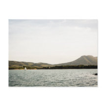 Small ship sailing on a lake at the afternoon
