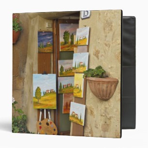 Small shope with artwork for sale on sidewalk binder