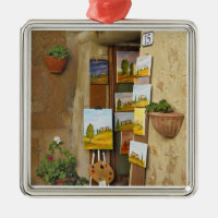 Small shope with artwork for sale on sidewalk