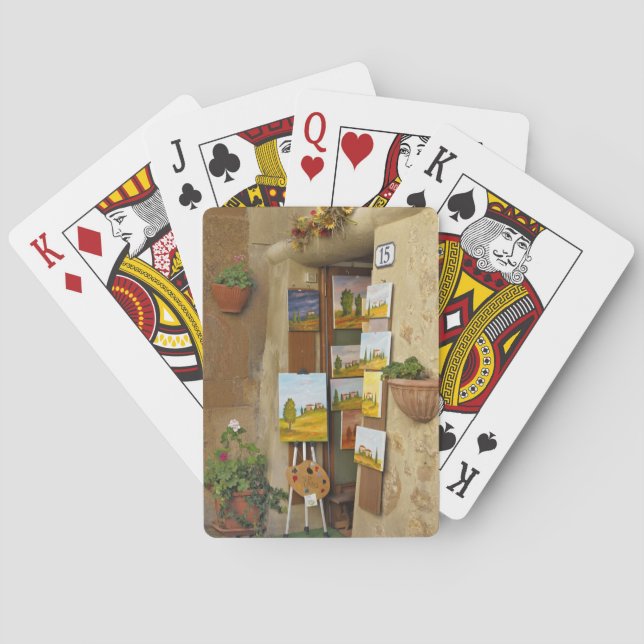 Small shope with artwork for sale on sidewalk playing cards (Back)