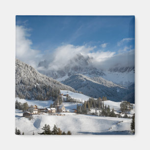 Small village with Dolomites mountains in the snow Magnet