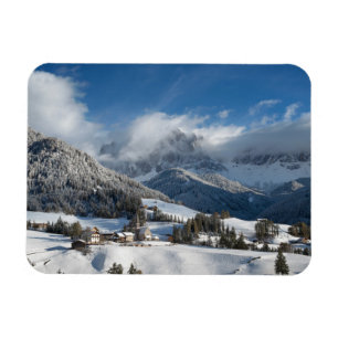 Small village with Dolomites mountains in the snow Magnet