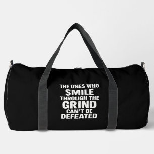 Smile grind gym motivation quote with white text duffle bag