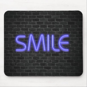 SMILE text in neon lights on brick Mouse Pad