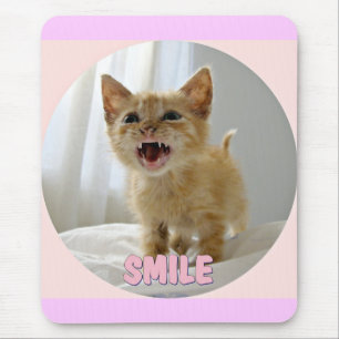 Smiling kitten mouse pad