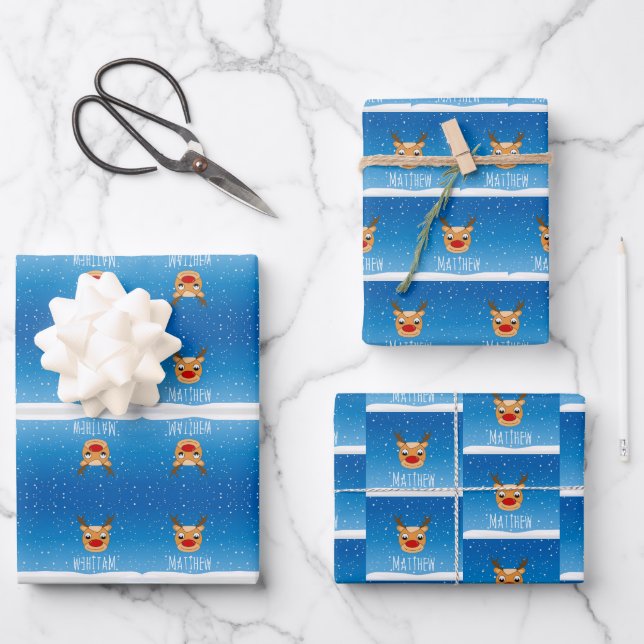 Smiling reindeer snowfall personalised blue wrapping paper sheet (Front)